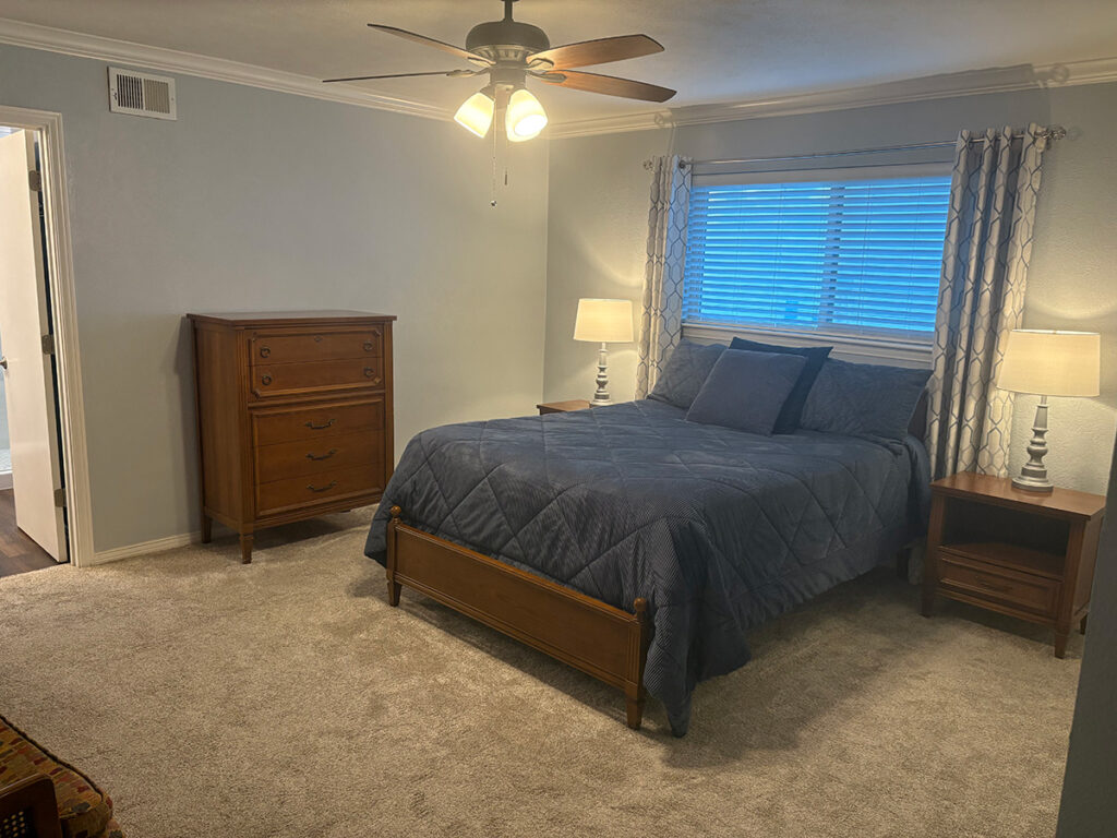 Staged Primary Bedroom of 7647 Querida Lane Dallas Texas 75248 for sale by owner